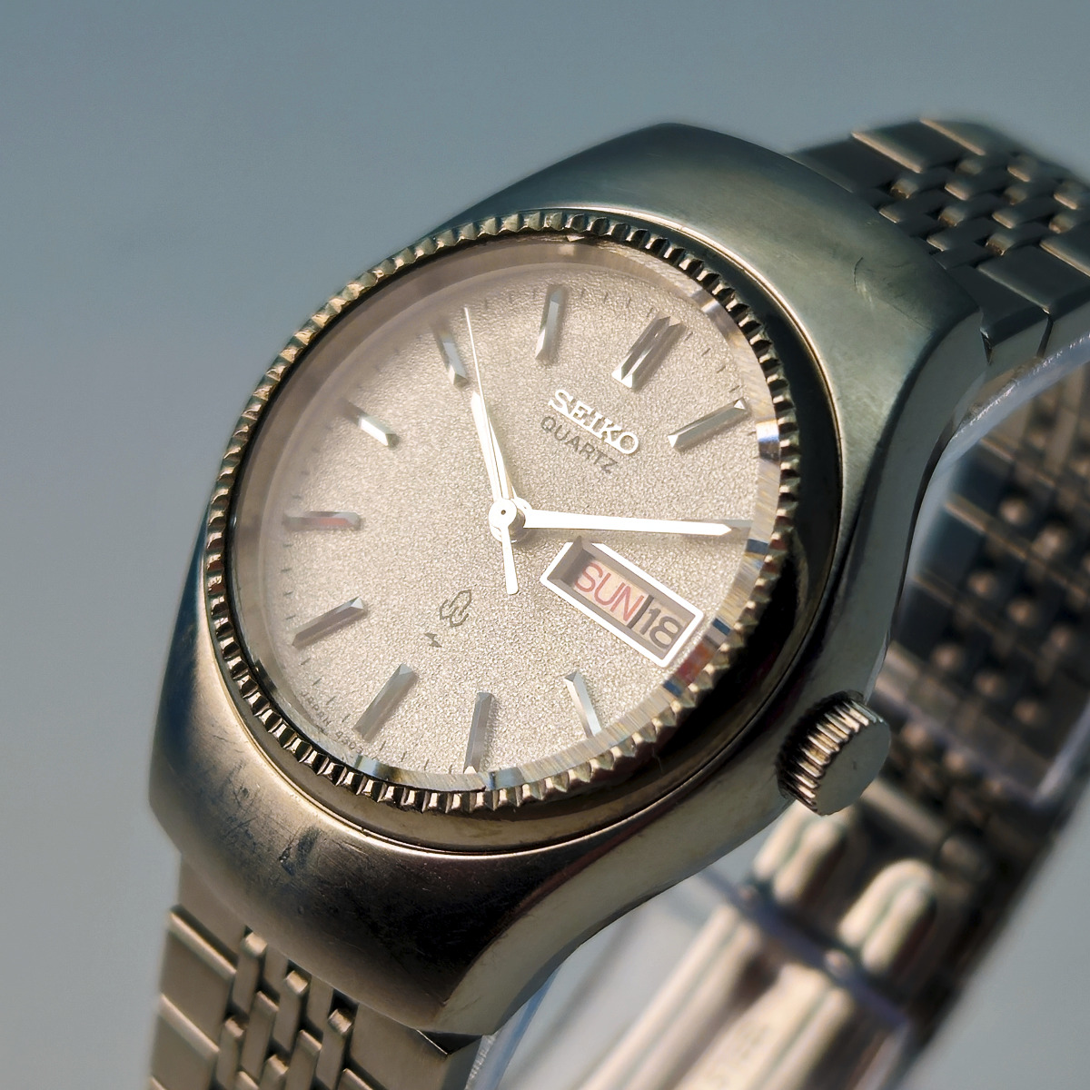 A Seiko 4303-0040 ladies quartz watch from 1976, with diamond dust dial and chamfered bezel. 
