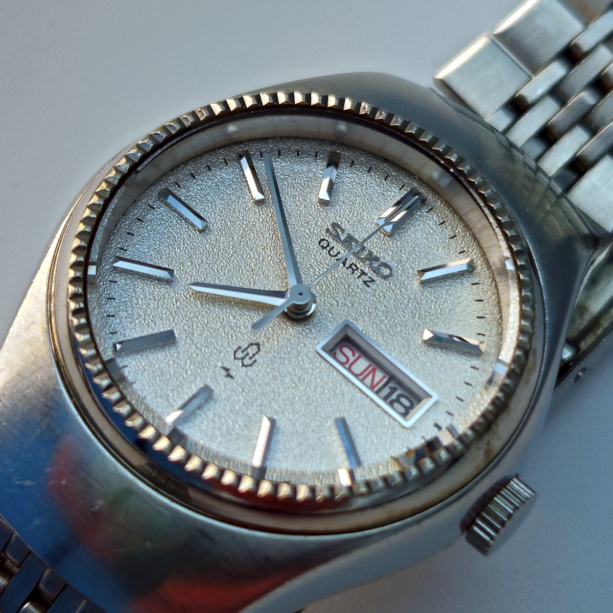 A Seiko 4303-0040 ladies quartz watch from 1976, with diamond dust dial and chamfered bezel. 
