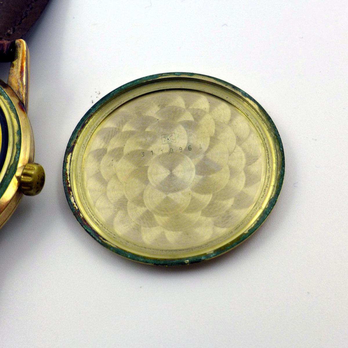 Inside case back, serial number